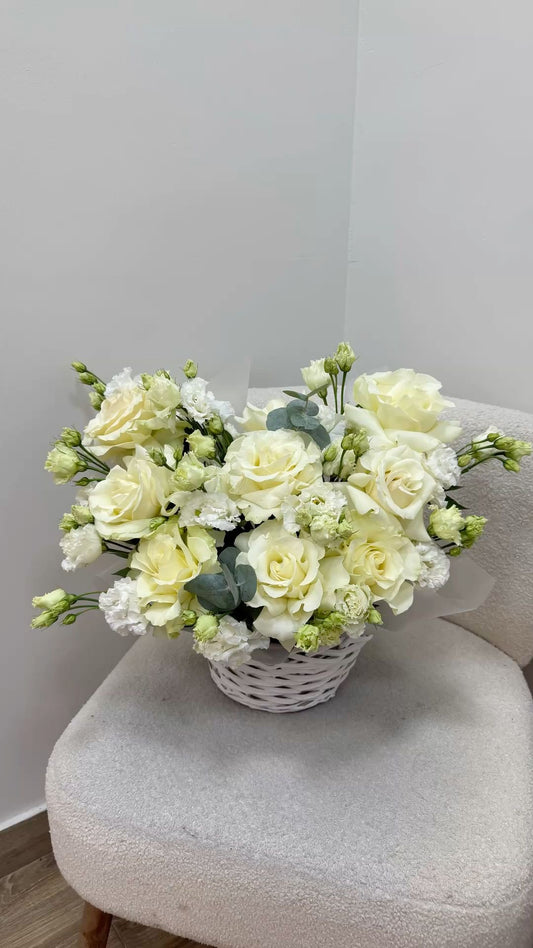 White eustoma and roses basket arrangement by Magic Flor Dubai