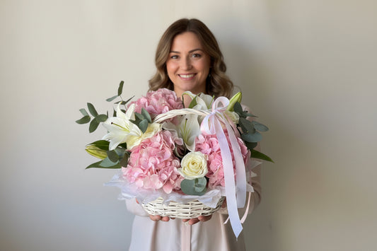 Pink hydrangeas and white lilies basket arrangement by Magic Flor Dubai